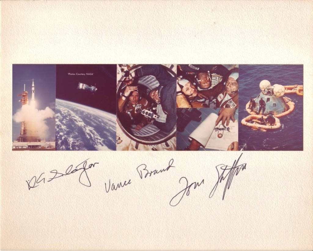 (ASTRONAUTS--APOLLO-SOYUZ.) Color Photograph, Signed by the American prime crew of the Apollo-Soyuz Test Project, composite image showi